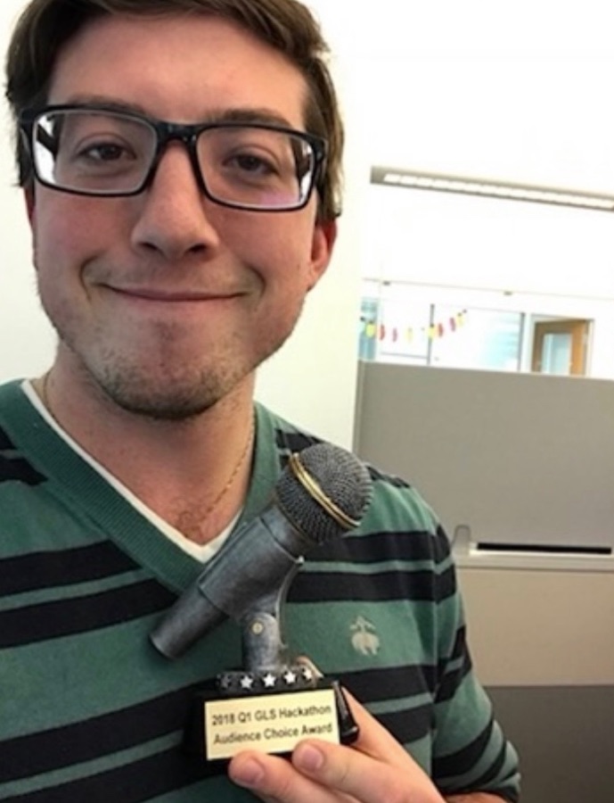 Ken Waks holding the Audience Choice Award trophy from the 2018 Q1 GLS Hackathon at Google